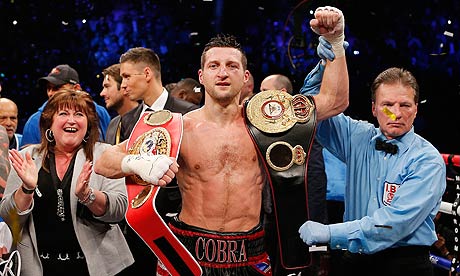 Carl Froch celebrates victory over Mikkel Kessler with his mother and his super-middleweight belts